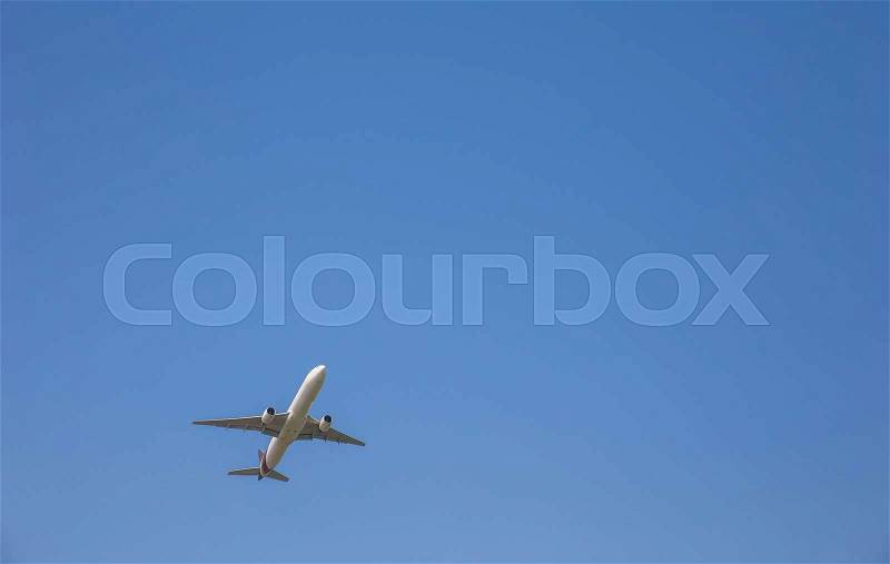 Airplane taking off at sky blue, stock photo