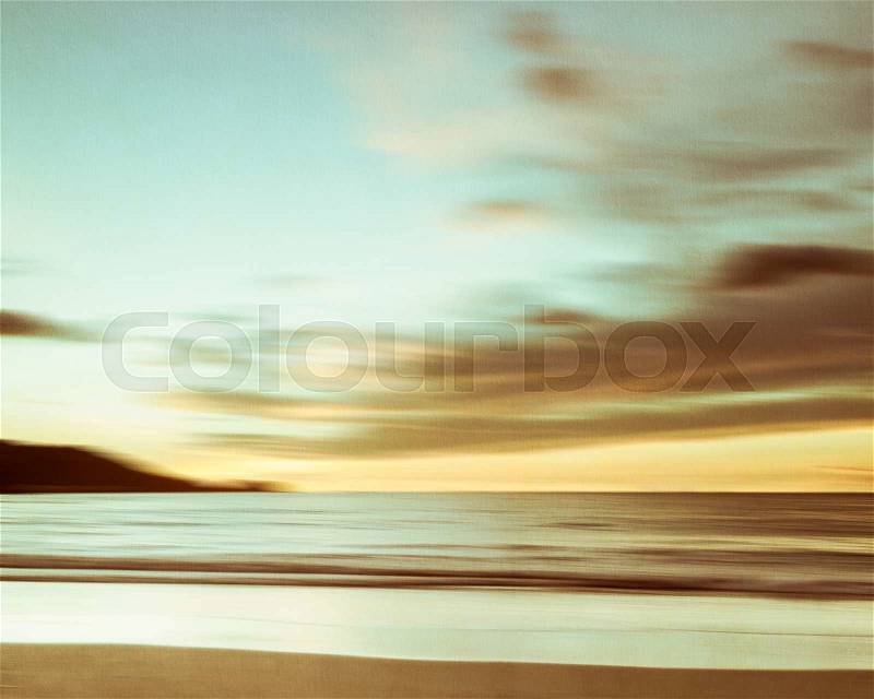 An abstract seascape with blurred panning motion with cross-processed colors on paper background, stock photo