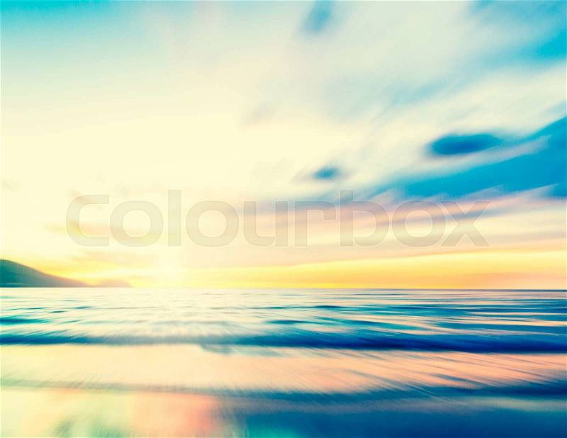An abstract seascape with blurred zoom motion with cross-processed colors on paper background, stock photo