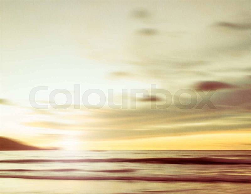 An abstract seascape with blurred panning motion with cross-processed colors on paper background, stock photo