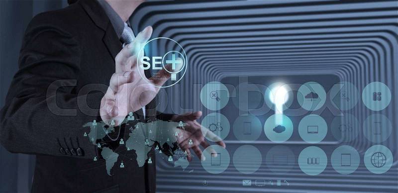 Businessman hand showing search engine optimization SEO as concept, stock photo