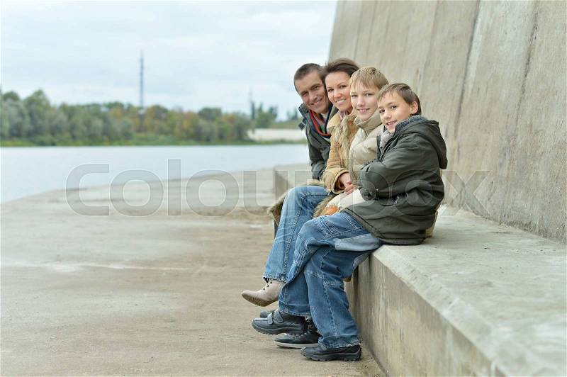 Happy Family at river embankment in autumn, stock photo