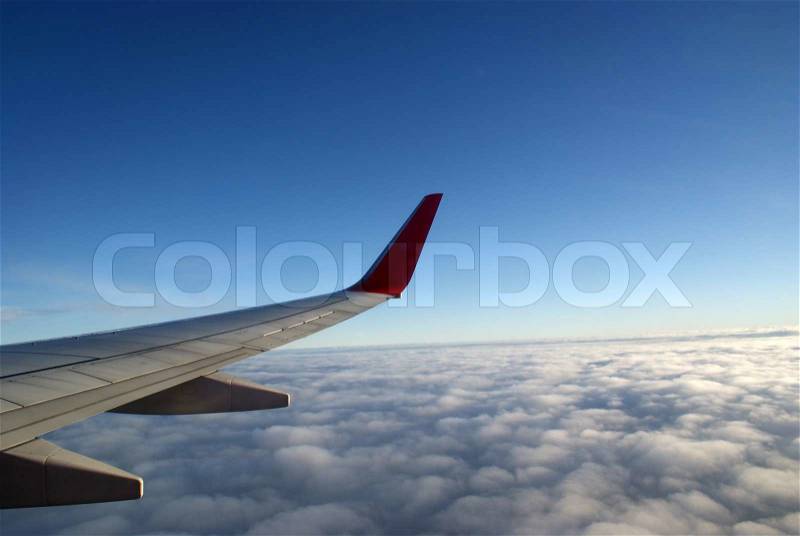 Flying above the sky. Wing of airplane, stock photo