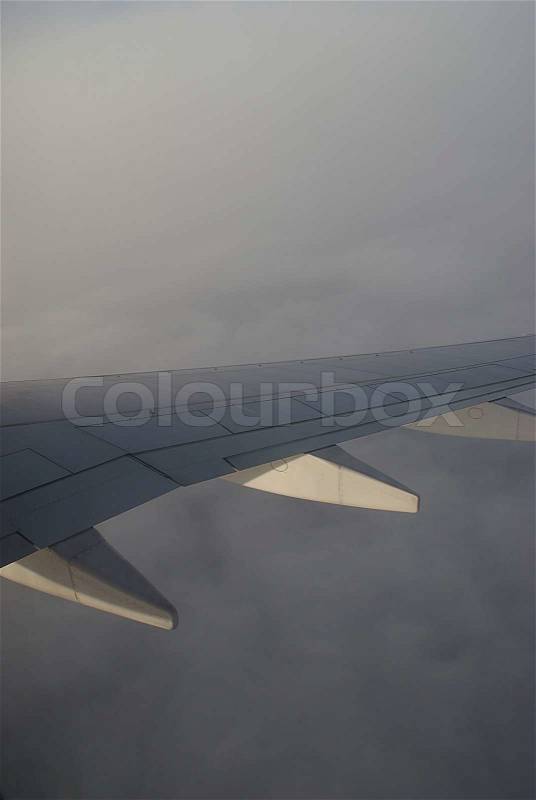 Flying above the sky. Wing of airplane, stock photo