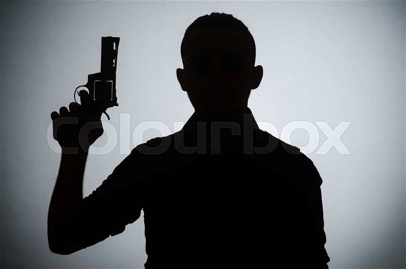 Shadow of the man with gun, stock photo