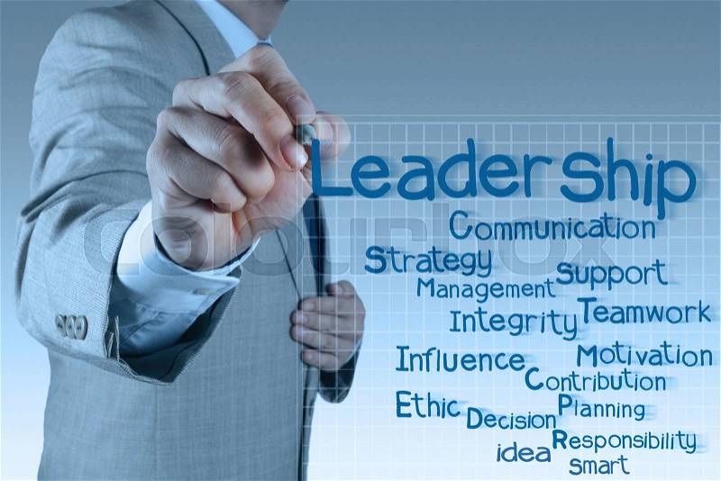 Businessman writing leadership skill diagram on virtual board, stock photo