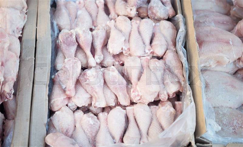 Frozen chicken meat at a market, stock photo
