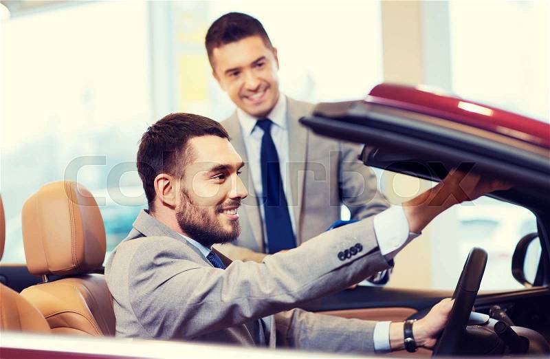 Auto business, car sale, consumerism and people concept - happy man with car dealer in auto show or salon, stock photo