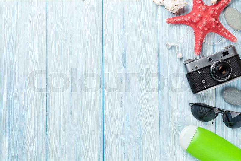 Travel and vacation background with items over wooden table. Top view with copy space, stock photo
