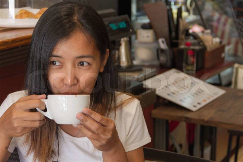 Coffee. Beautiful Girl Drinking Tea or Coffee. Beauty Woman enjoying Coffee. Cup of Hot Beverage, stock photo