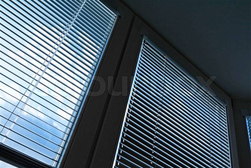 Window blinds for sun protection, heat protection. Sky behind plate, stock photo