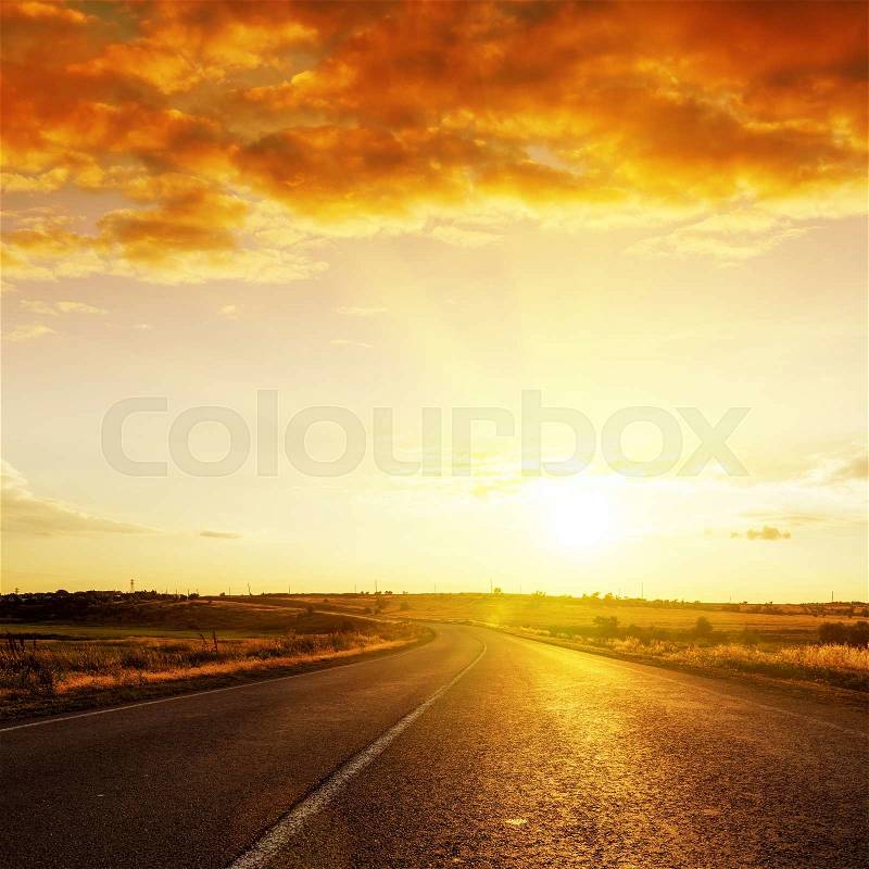 Red sunset over road to horizon, stock photo