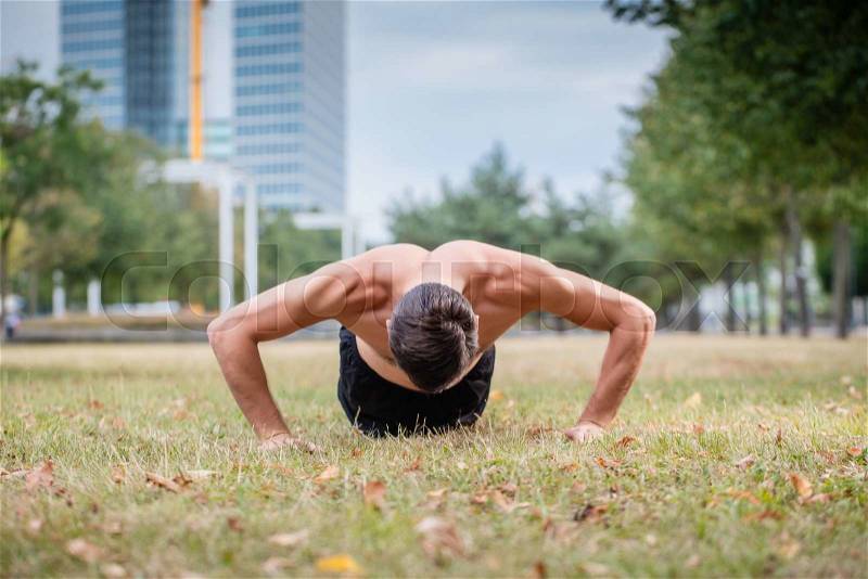 Man doing push-up as sport for better fitness, stock photo