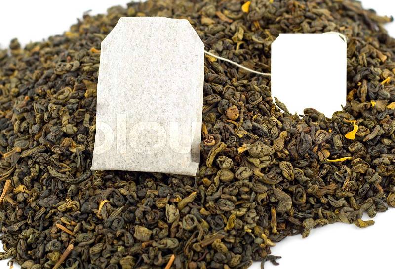 Tea bag on green tea background,label for advertisment empty, stock photo