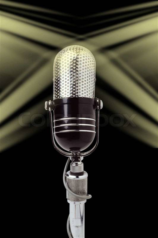 Vintage microphone over black background, stock photo