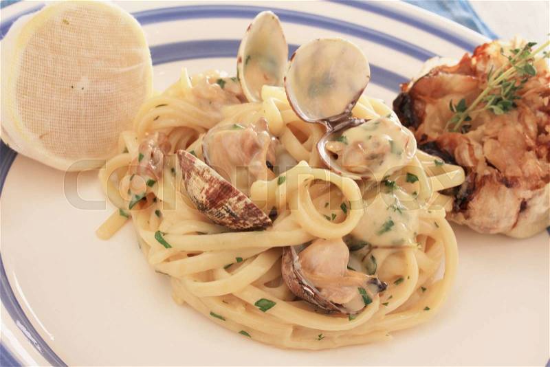 Clam linguine plated meal, stock photo