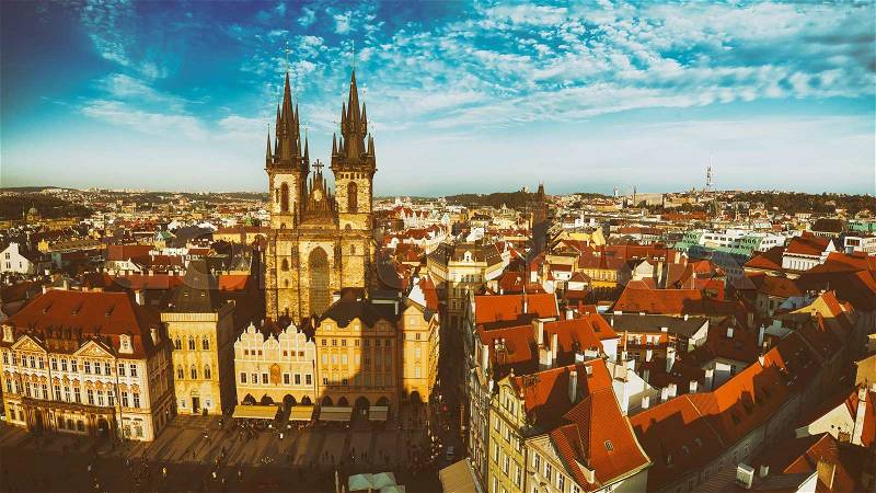 Old Town Square with Church of Our Lady before Tyn in eastern european Czech capital Prague - panoramic vintage sunny view from Town Hall, stock photo