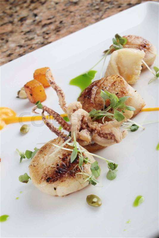 Pan fried scallops plated meal appetizer starter, stock photo