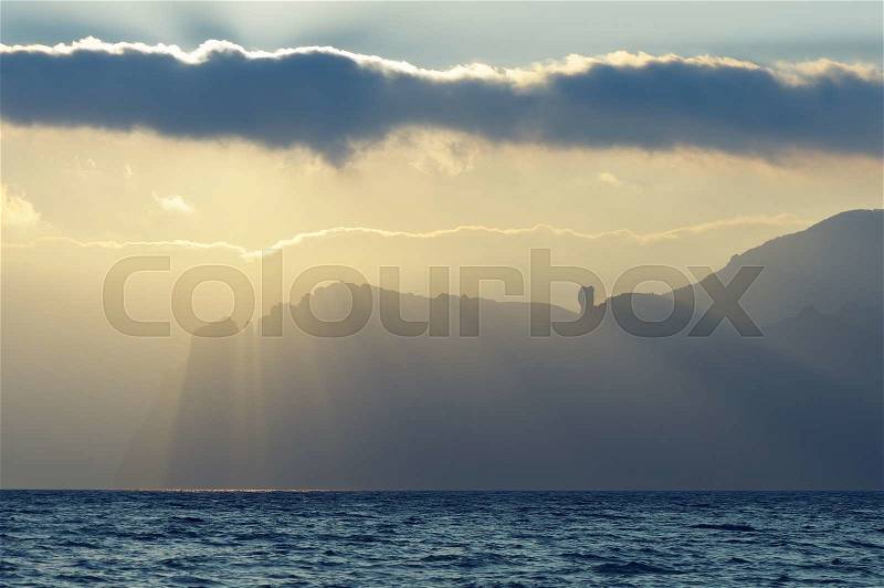 Seascape with beautiful sunshine. Rock on the coast. The peninsula of Crimea, stock photo