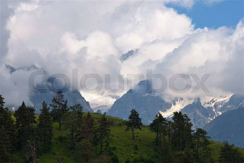Summer landscape with mountains in the clouds. Main Caucasian ridge. Zemo Svaneti, Georgia , stock photo