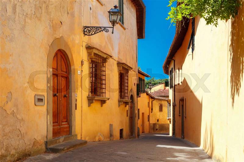 Typical narrow roman street of old town in sunny summer day, Florence, Tuscany, Italy, stock photo
