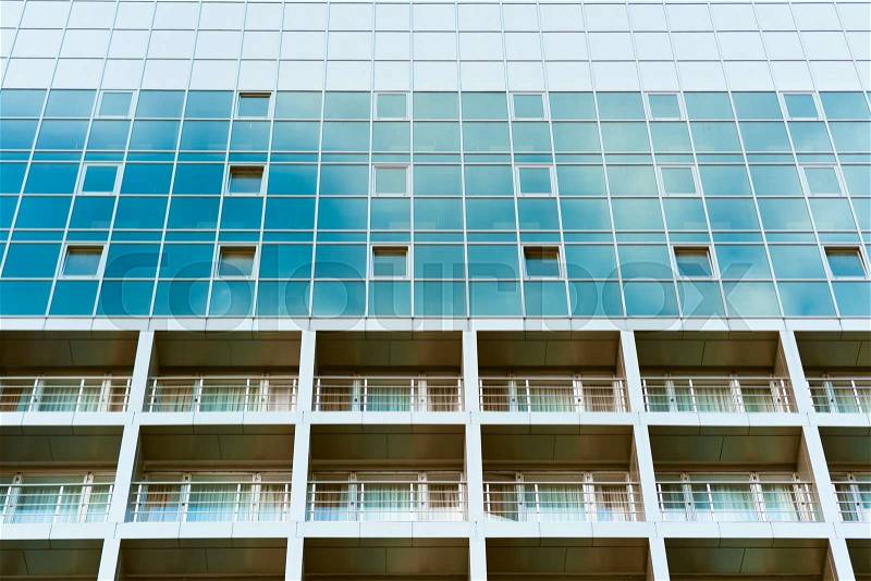 Blue glass building with balconies, stock photo