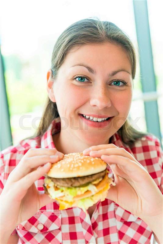 Happy beautiful girl in the restaurant and fast food, stock photo