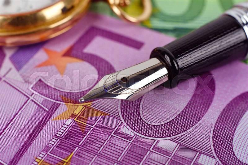 Five hundred euro bills and ink pen, extra close up, stock photo