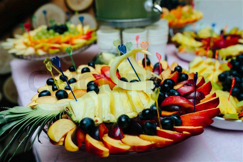 Carved fruits arrangement. Fresh various fruits. Assortment of exotic fruits. Fresh fruits decoration, stock photo