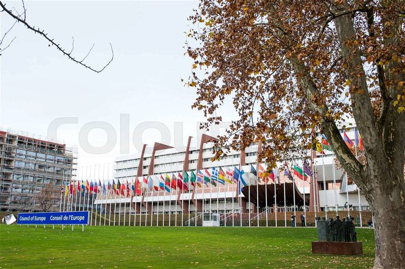 STRASBOURG, FRANCE - 14 Nov 2015: All European Union Flag flies at half-mast in front of the Council of Europe following an terrorist attack in Paris, stock photo