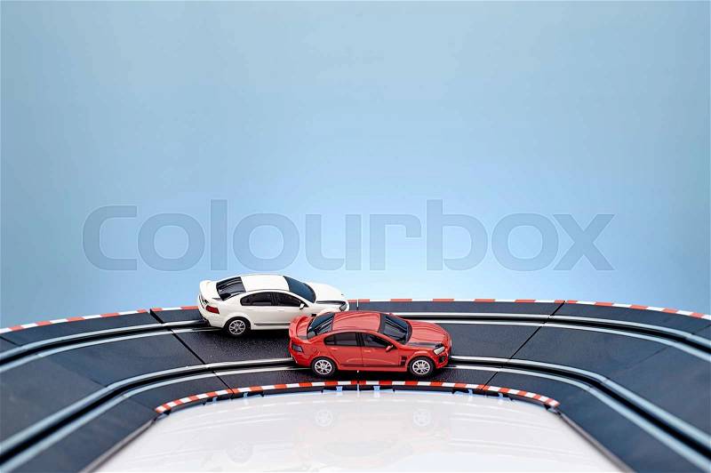 A studio photo of a slot car race set, stock photo