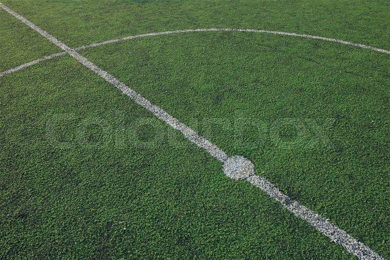 Artificial soccer field stadium on the green grass, sport game background for design, stock photo