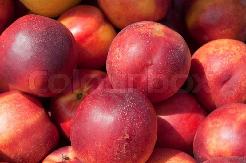 Background of ripe, juicy peach red, stock photo