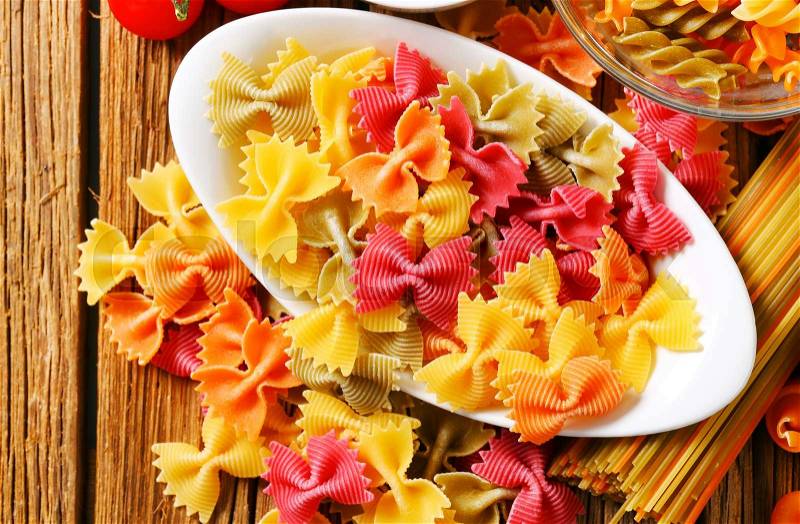 Flavored and colored bow tie pasta, stock photo