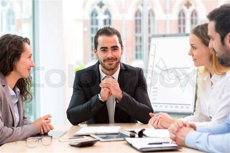 View of a Boss heading a business reunion with partners, stock photo