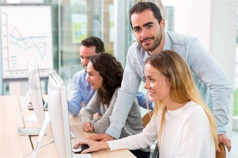 View of a Young attractive people taking a training course with formator, stock photo