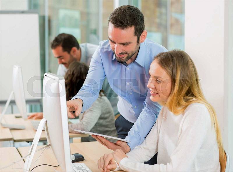 View of a Young attractive people taking a training course with formator, stock photo