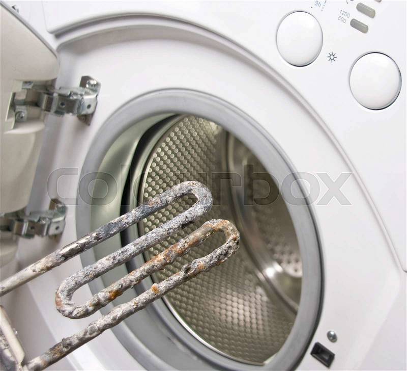 Washing machine and damaged electric heater, stock photo