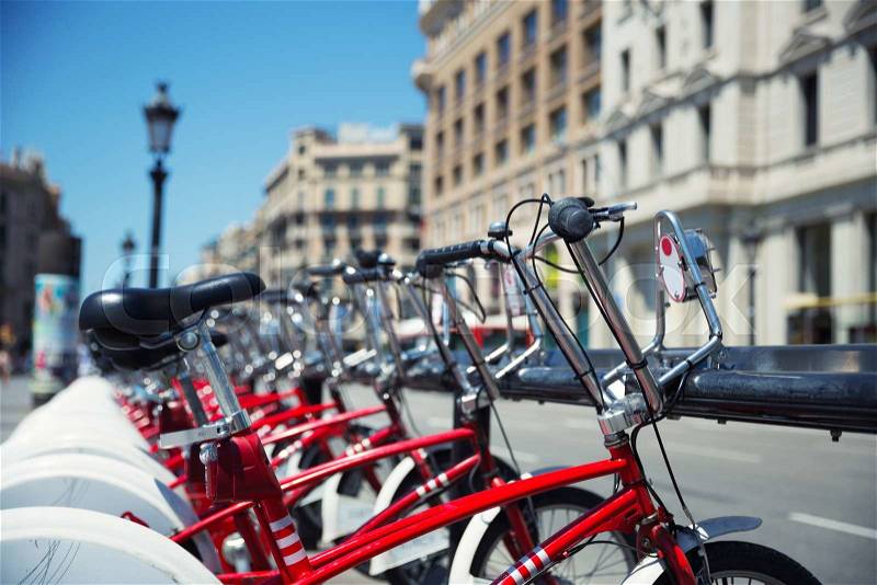 City bicycles for rent parked in Barcelona, stock photo