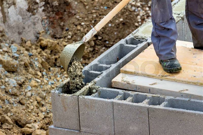 Scarf stones are filled with concrete. concrete work on a construction site of a house, stock photo
