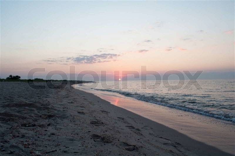 Seascape - sunrise. Sea, sand and sun - the primitive beauty, stock photo