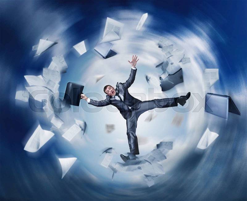 Businessman falling in space with papers, stock photo