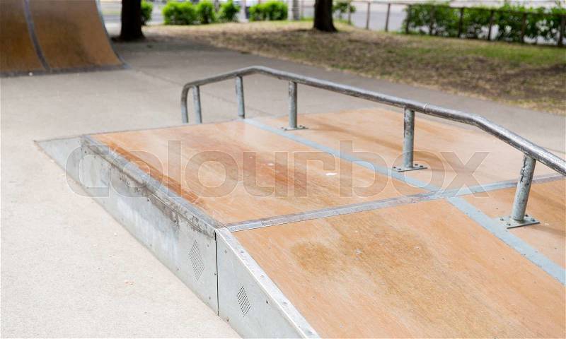 Extreme sport, skateboarding, equipment and youth culture concept - close up of ramp at city skatepark, stock photo