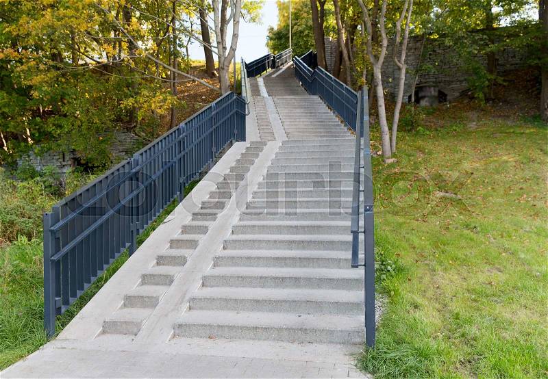 Architecture concept - stair case with railings in autumn park, stock photo