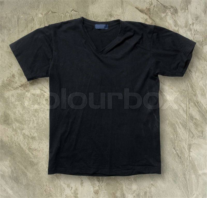 Black t-shirt on Grey grunge floor, stock photo