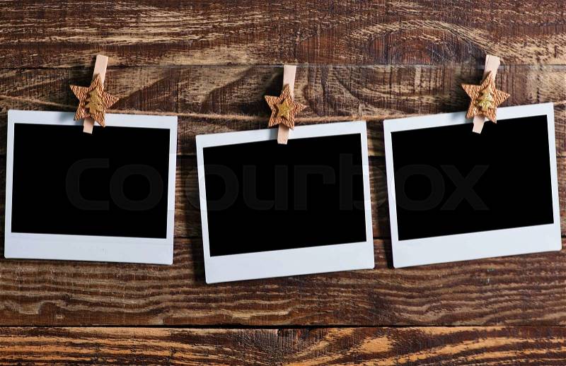 Photo paper, photo cadr on the wooden background, stock photo