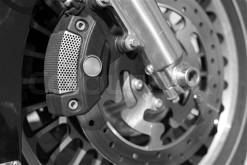 Detail of the front wheel of a motorcycle with disc brake, stock photo