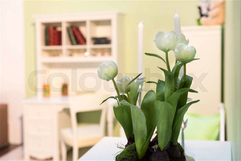 Bouquet of white flowers stands on the table in the bedroom, stock photo