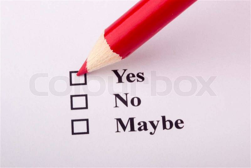 A red pencil checking the yes box on an opinion poll, stock photo