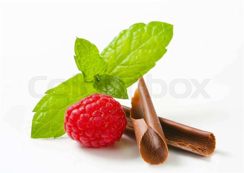 Chocolate curls and fresh red raspberry, stock photo